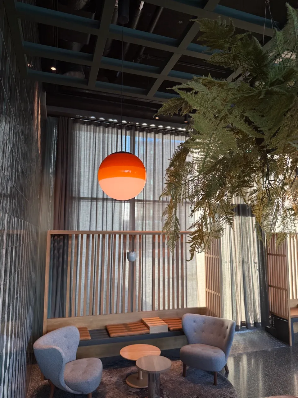 Orange and white custom glass pendant shade showing hanging alignment after installation