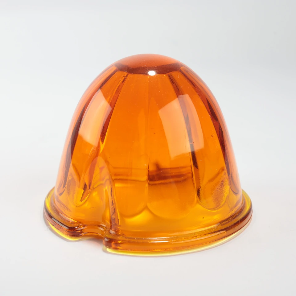 Amber translucent faceted glass dome with a notched circular base flange