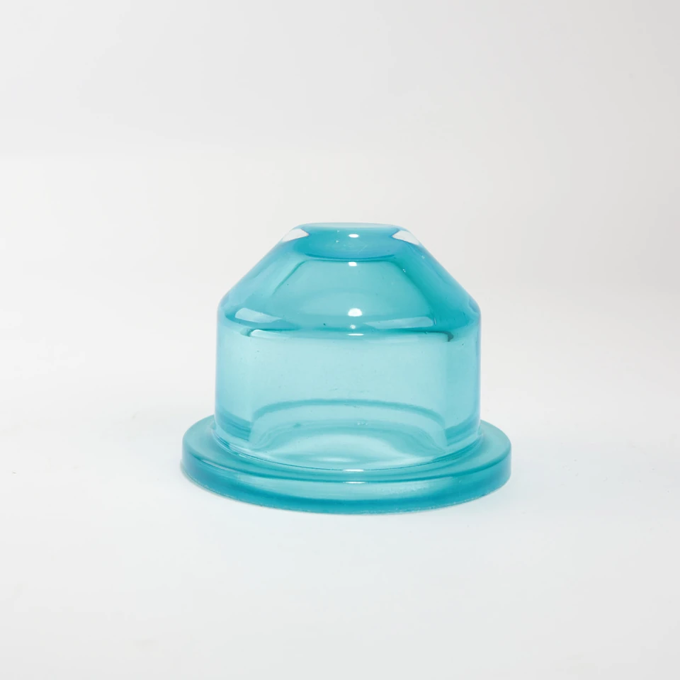 Aqua blue glass cover with a faceted shoulder and broad circular base flange