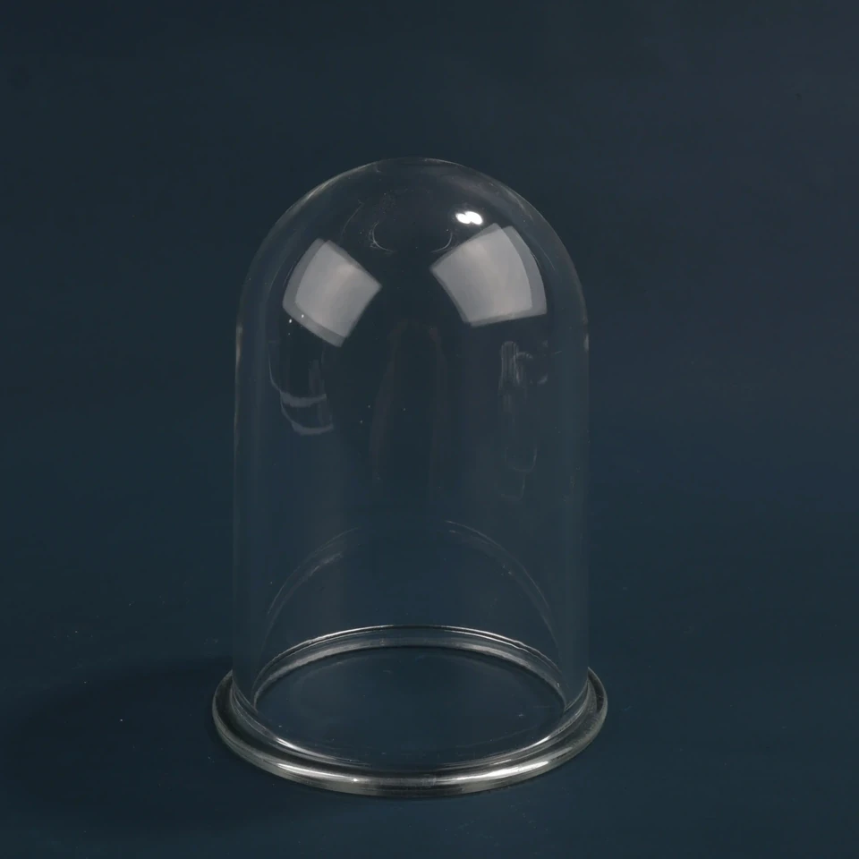 Clear smooth glass dome standing on an open circular rim against a dark background