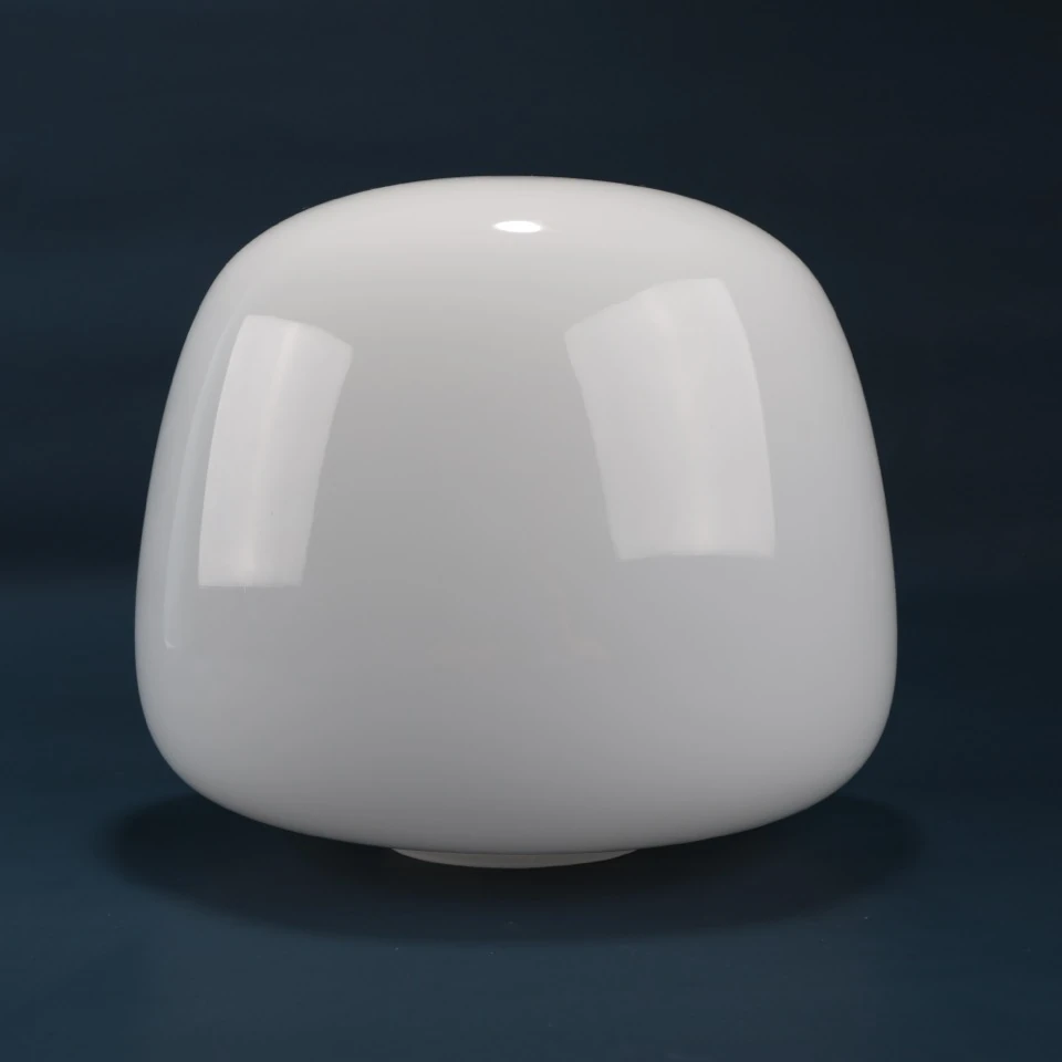 Gloss white rounded mushroom lighting glass shade against a dark background