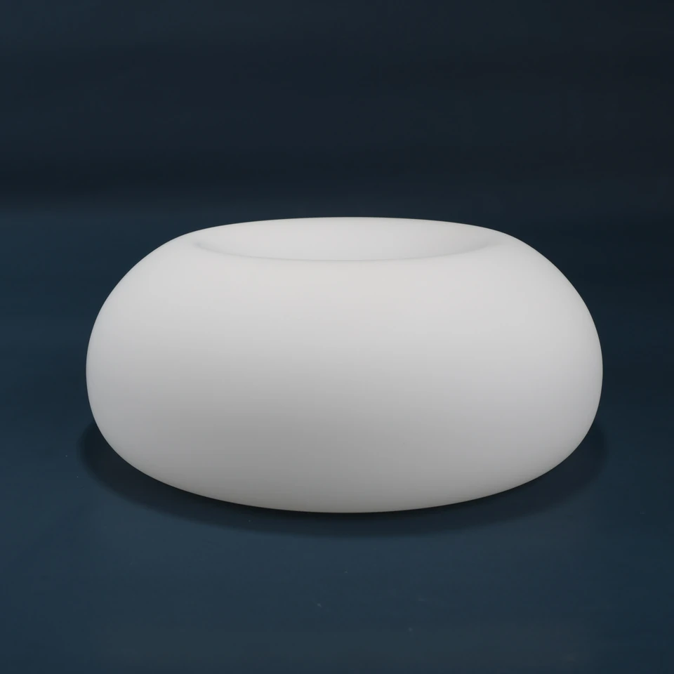 Matte white shallow rounded glass shade on a dark background