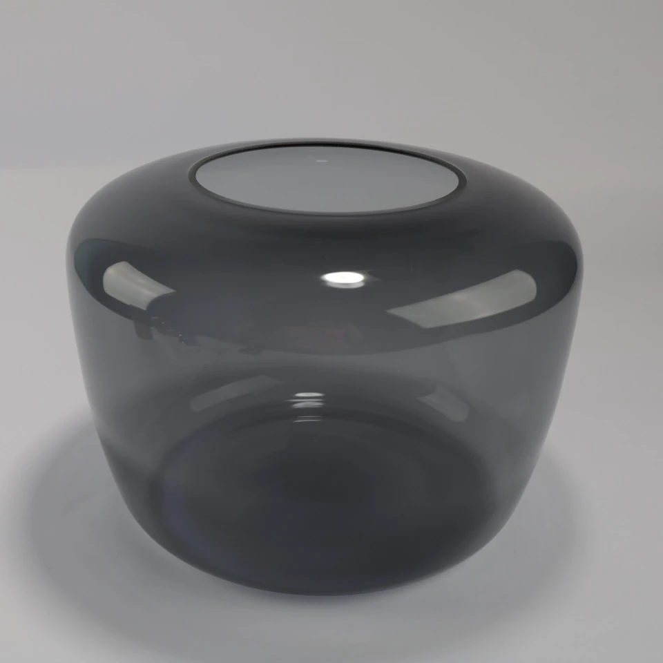Underside view confirming a larger circular opening in the glass shade